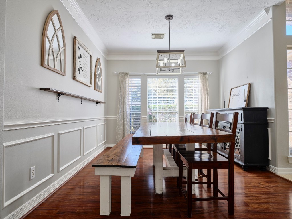 9315 Anna Street Needville, TX 77461 - Photo 10 of 46 a view of a dining room with furniture window and wooden floor