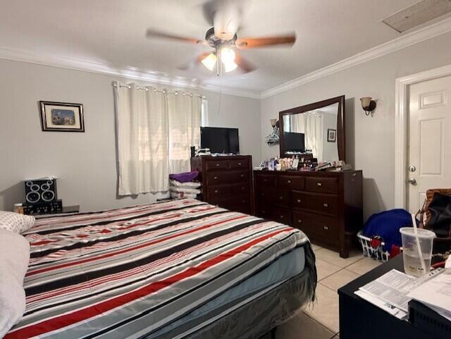 4904 Myrtle Drive Fort Pierce, FL 34982 - Photo 11 of 18 a bedroom with a bed and a television