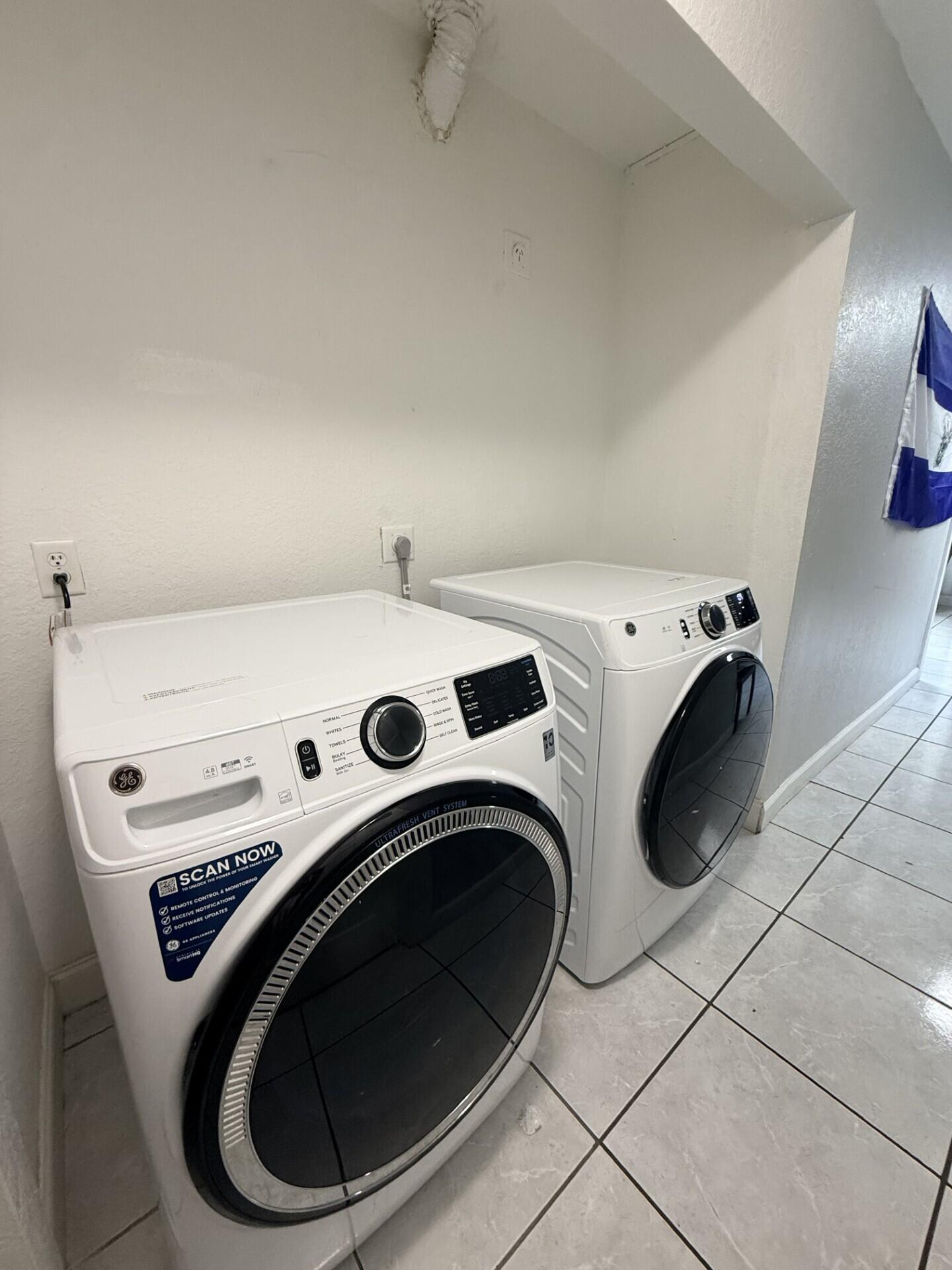 4904 Myrtle Drive Fort Pierce, FL 34982 - Photo 17 of 18 a utility room with dryer and washer