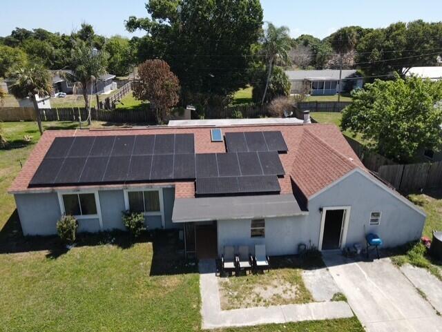 4904 Myrtle Drive Fort Pierce, FL 34982 - Photo 2 of 18 a aerial view of a house with a yard