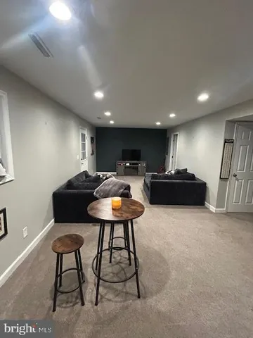 a room with furniture and a potted plant