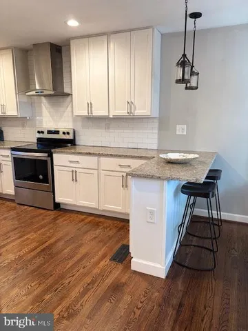 a kitchen with a sink cabinets and window