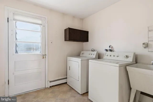 a utility room with dryer and washer