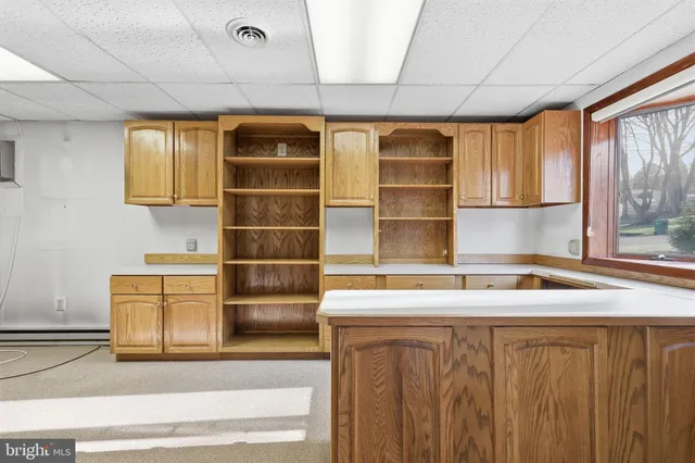 a kitchen with a refrigerator and a sink