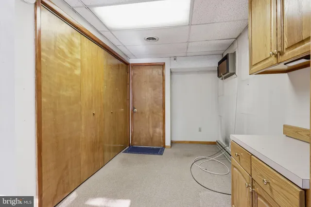 a view of entryway with bathroom