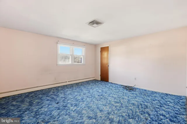 an empty room with a empty space and a window