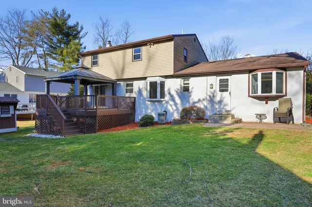 a front view of house with yard and outdoor seating