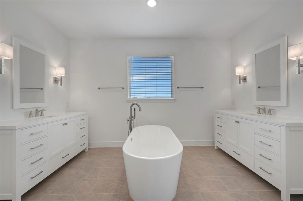 1004 Ashcroft Lane Justin, TX 76247 - Photo 13 of 39 a bathroom with a sink and a bathtub