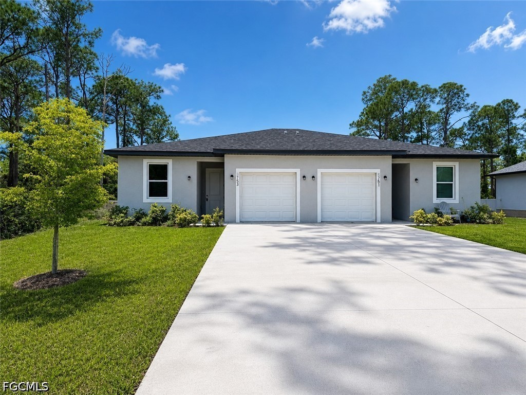 a view of a house with a yard