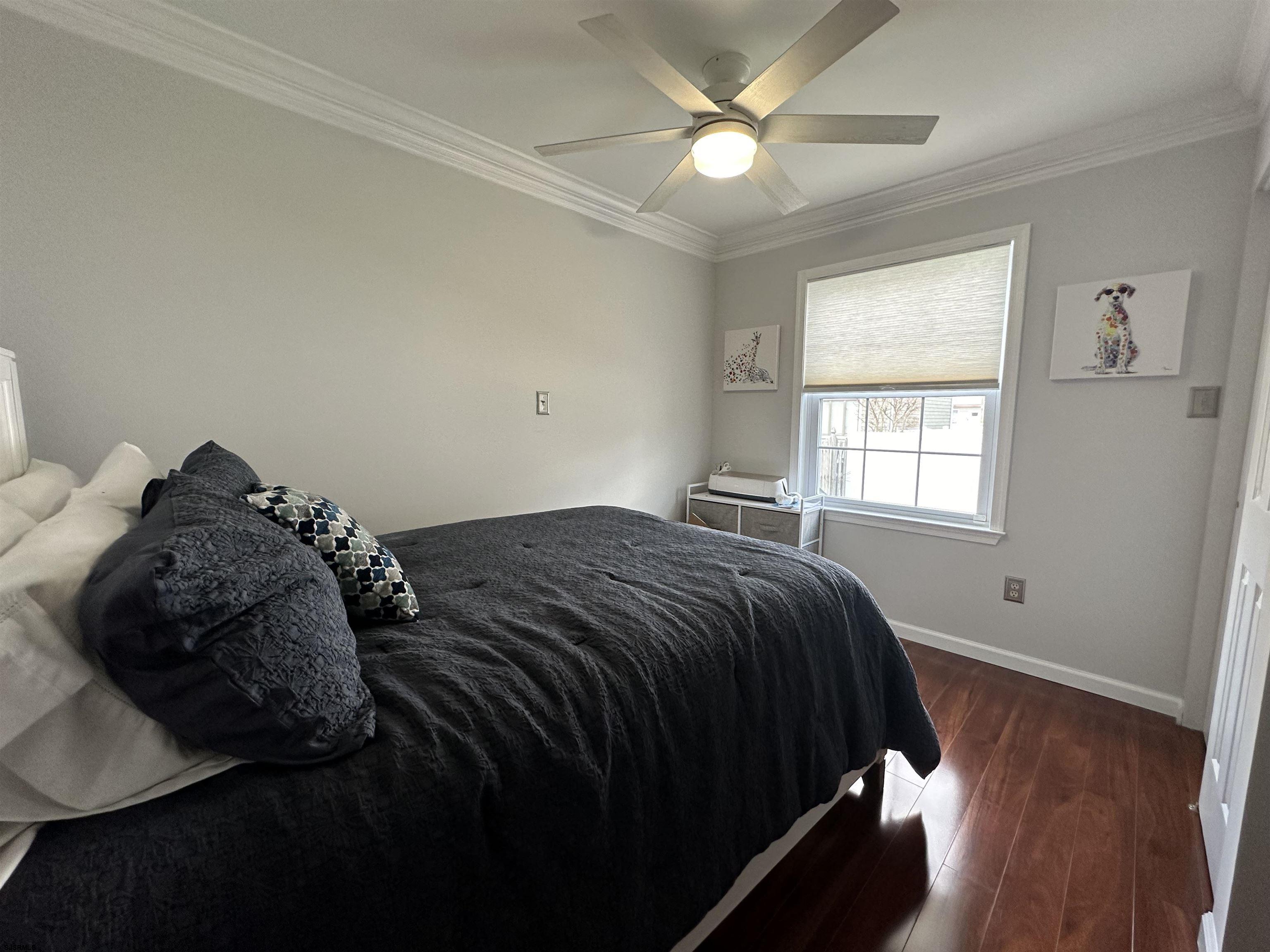 5701 Ventnor Avenue, Unit 5/217/31 Ventnor City, NJ 08406 - Photo 15 of 44 a bedroom with a bed and a window