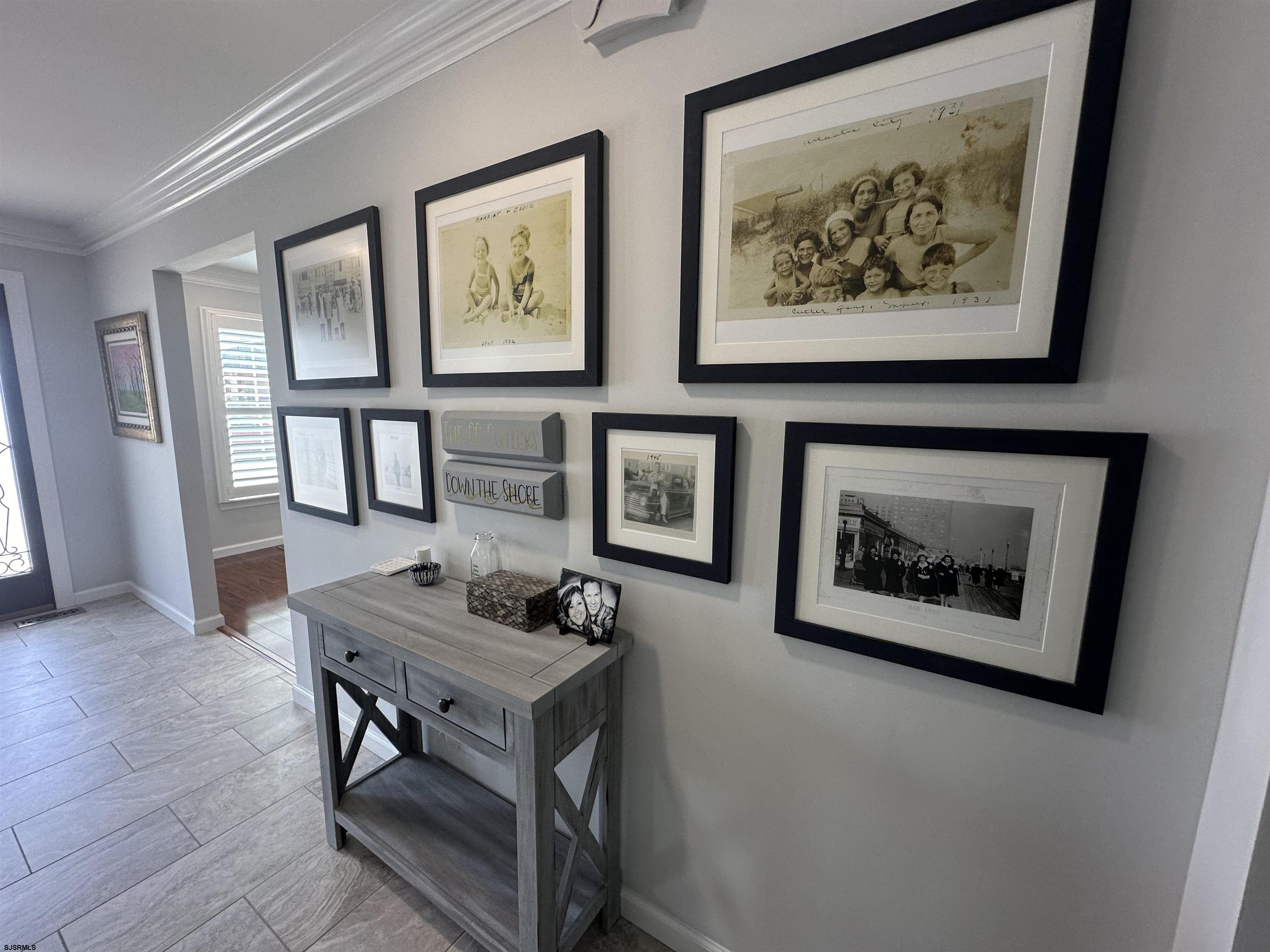 5701 Ventnor Avenue, Unit 5/217/31 Ventnor City, NJ 08406 - Photo 2 of 44 a living room with furniture and a painting on the wall