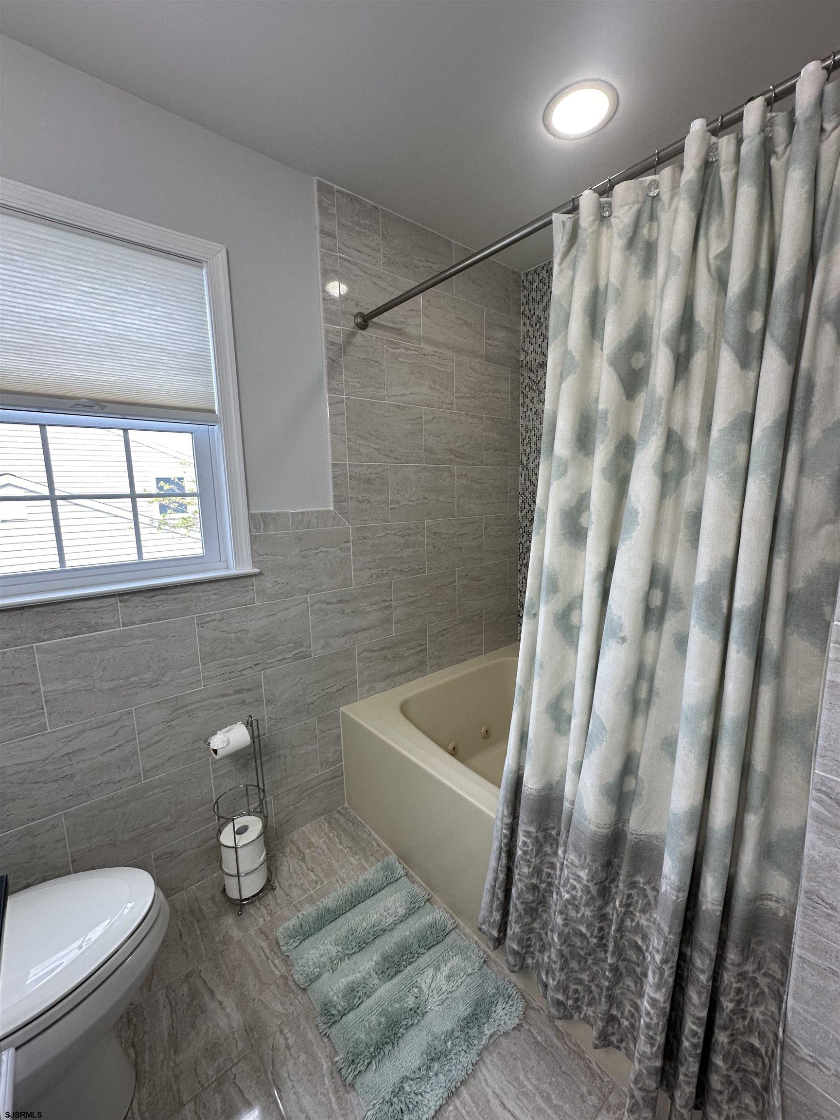 5701 Ventnor Avenue, Unit 5/217/31 Ventnor City, NJ 08406 - Photo 28 of 44 a bathroom with a sink and a toilet