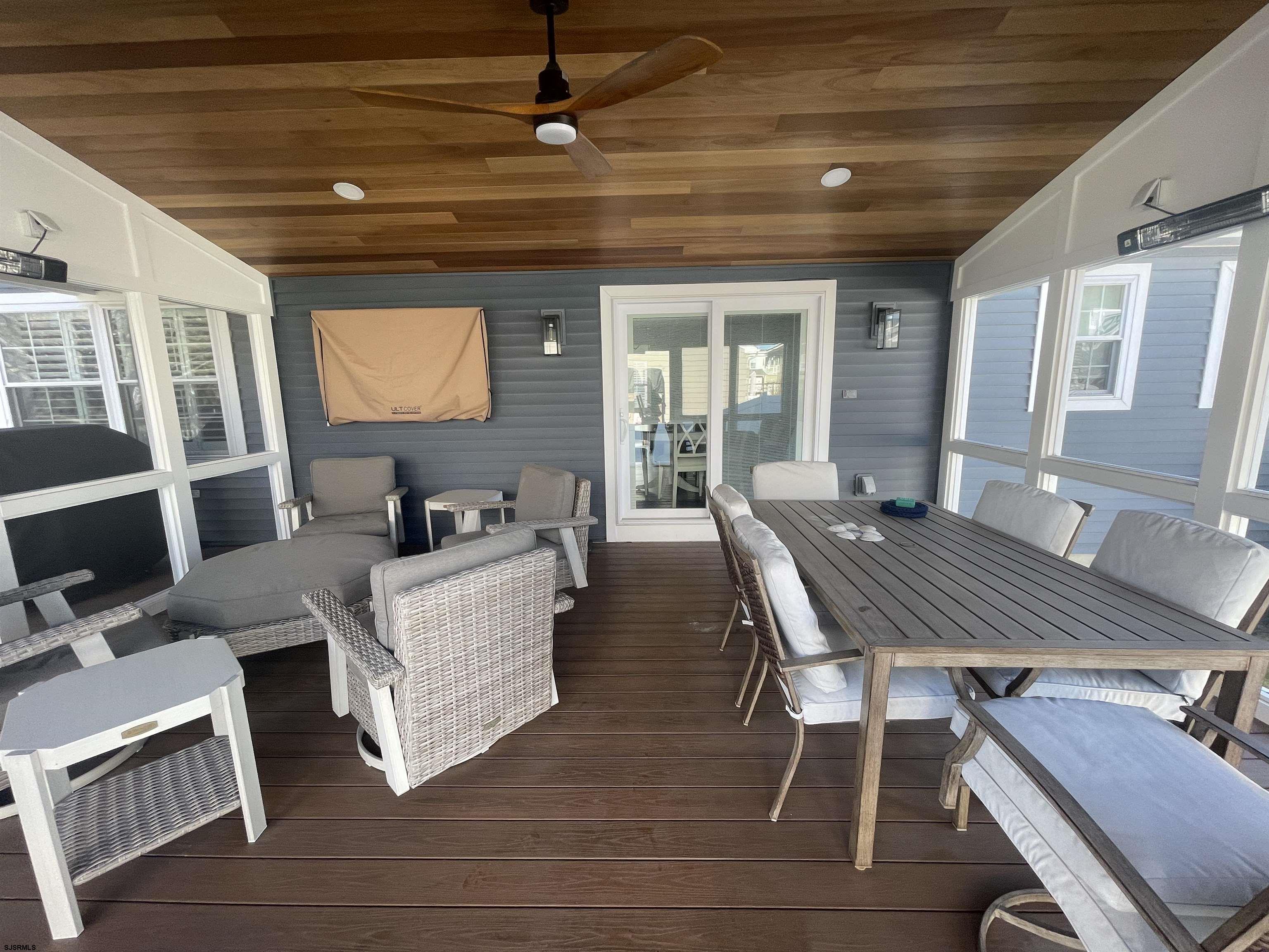 5701 Ventnor Avenue, Unit 5/217/31 Ventnor City, NJ 08406 - Photo 41 of 44 a living room with furniture and a flat screen tv