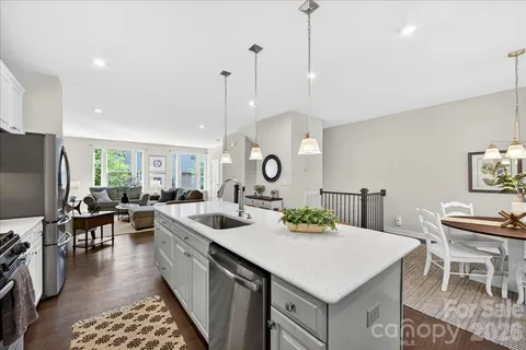 a kitchen with a dining table and chairs