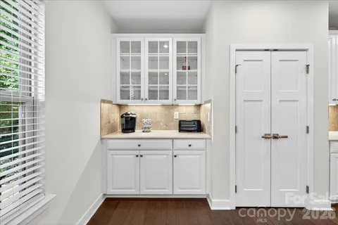 a view of cabinets and window
