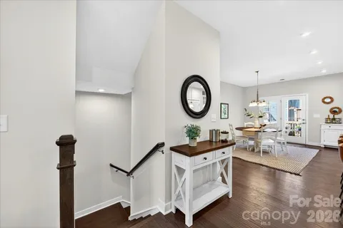 a living room with furniture and a mirror