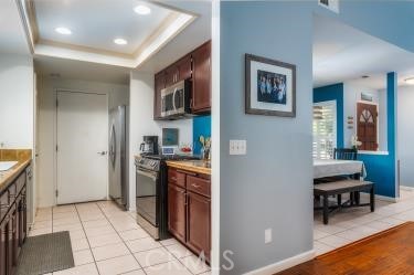 4227 Shadowcrest Drive Santa Maria, CA 93455 - Photo 6 of 21 a kitchen with stainless steel appliances granite countertop a refrigerator and a stove top oven