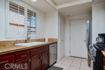 4227 Shadowcrest Drive Santa Maria, CA 93455 - Photo 8 of 21 a bathroom with a granite countertop sink a mirror and a shower