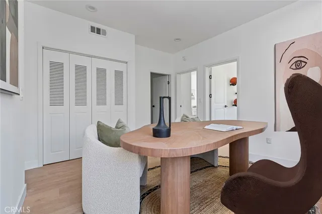 a view of a dining room with furniture and window