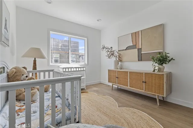 a bedroom with furniture and a window