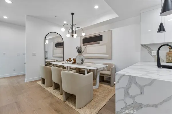 a view of a kitchen area with furniture and chandelier