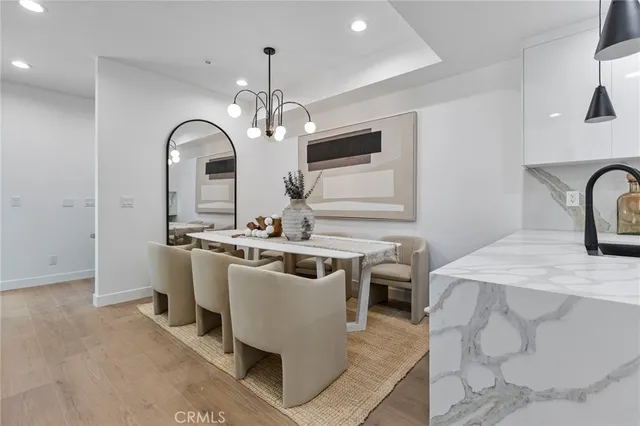 a view of a kitchen area with furniture and chandelier
