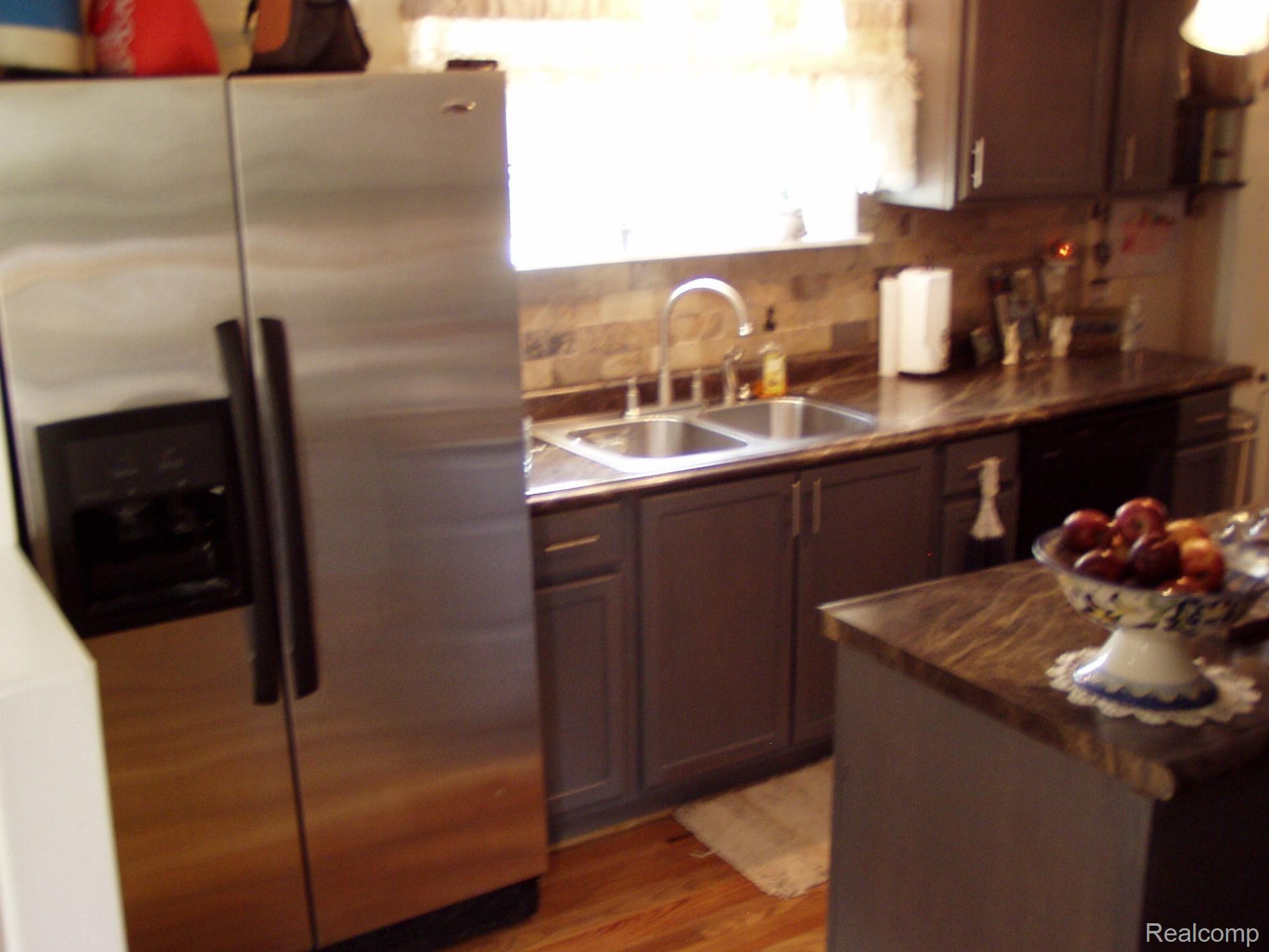 36850 Herman Street Romulus, MI 48174 - Photo 12 of 18 Stainless steel refrigerator and sink