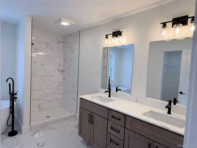 a bathroom with a double vanity sink a and mirror