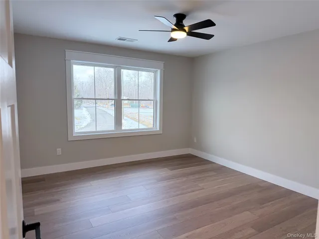 a view of a house with a yard and a garden