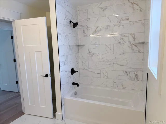 a front view of a house with plants