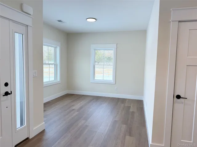 a kitchen with a refrigerator sink and cabinets