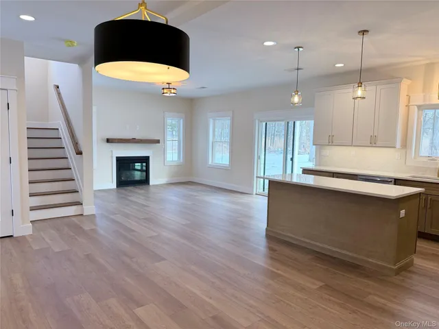 a kitchen with a refrigerator a sink and cabinets