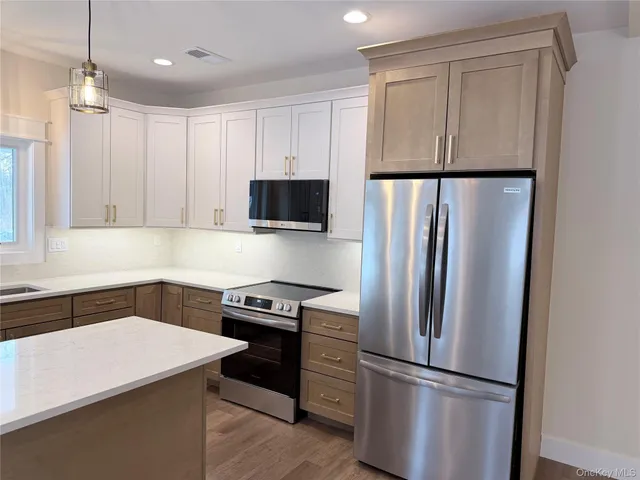 a bathroom with a toilet a sink a vanity and mirror