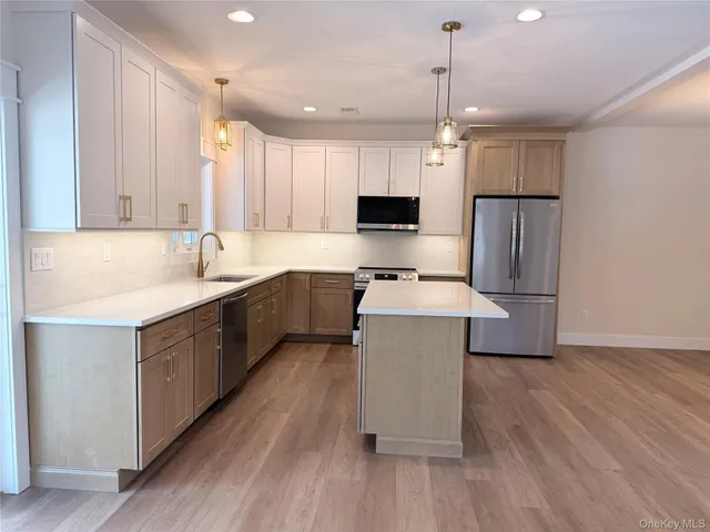a bathroom with a shower sink and mirror