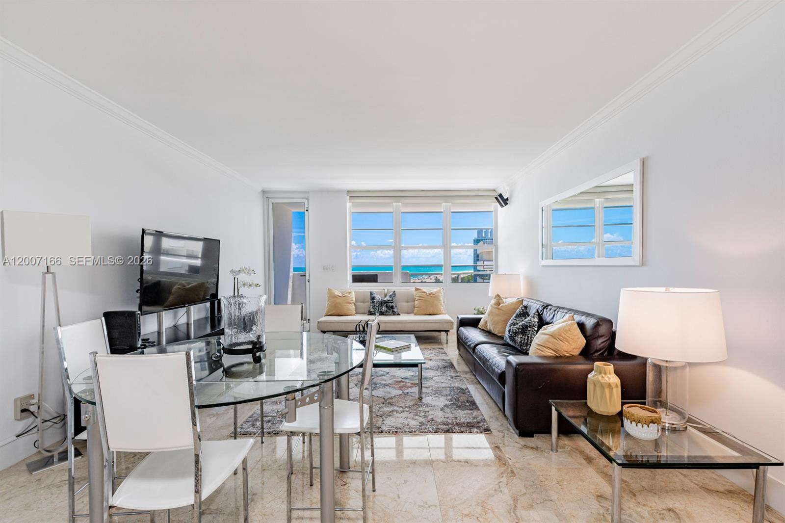 100 Lincoln Road, Unit 944 Miami Beach, FL 33139 - Photo 11 of 40 a living room with furniture and a flat screen tv