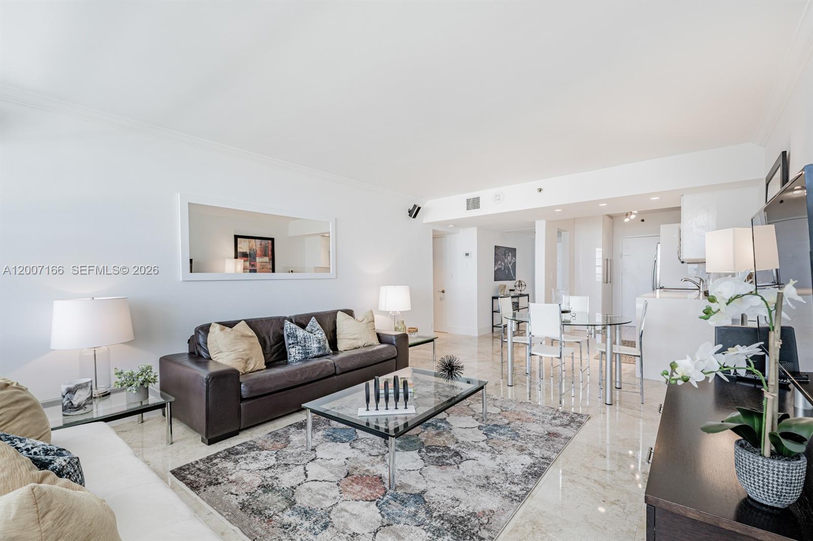 100 Lincoln Road, Unit 944 Miami Beach, FL 33139 - Photo 12 of 40 a living room with furniture potted plant and a lamp