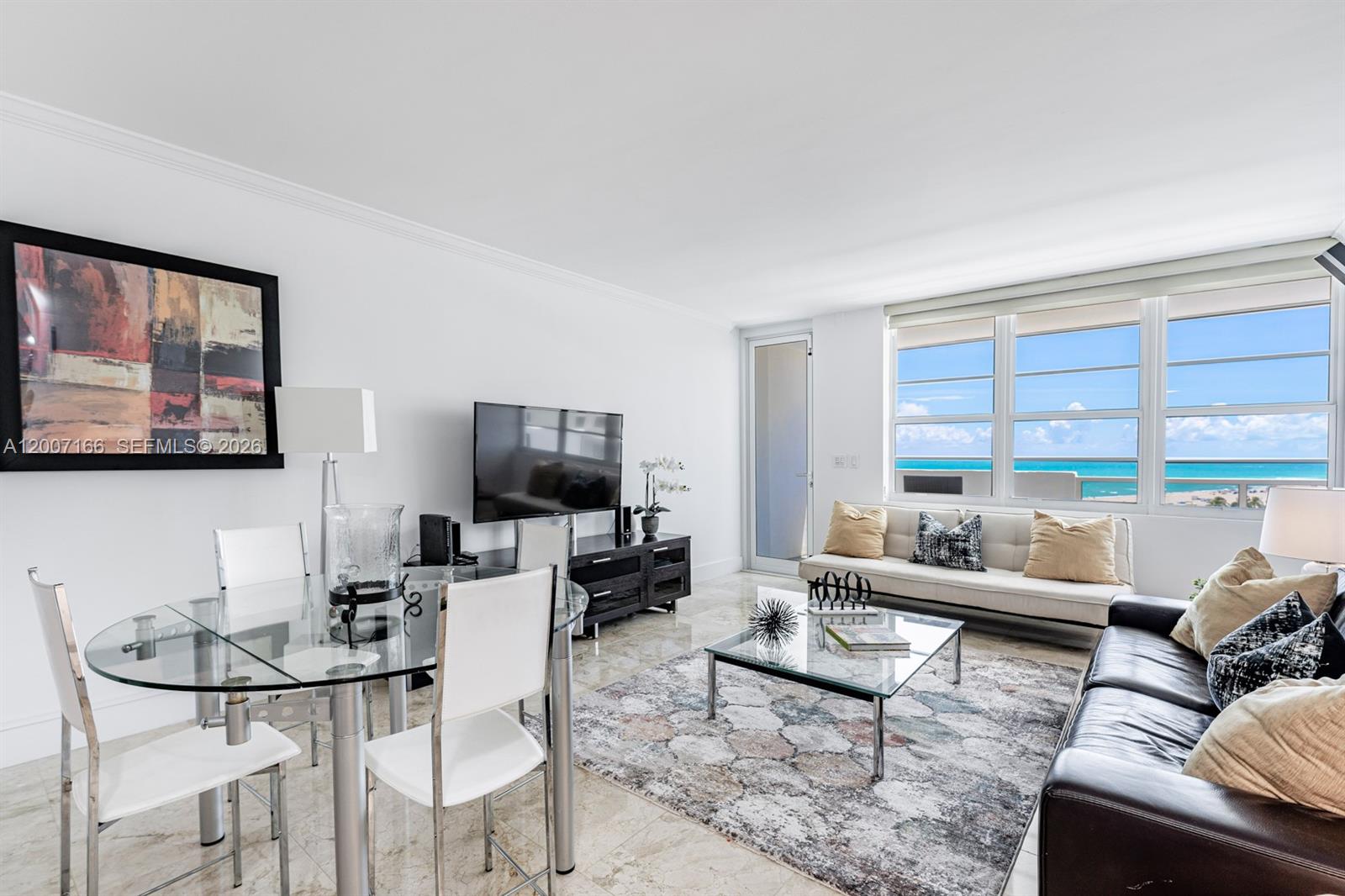 100 Lincoln Road, Unit 944 Miami Beach, FL 33139 - Photo 13 of 40 a living room with furniture and a flat screen tv