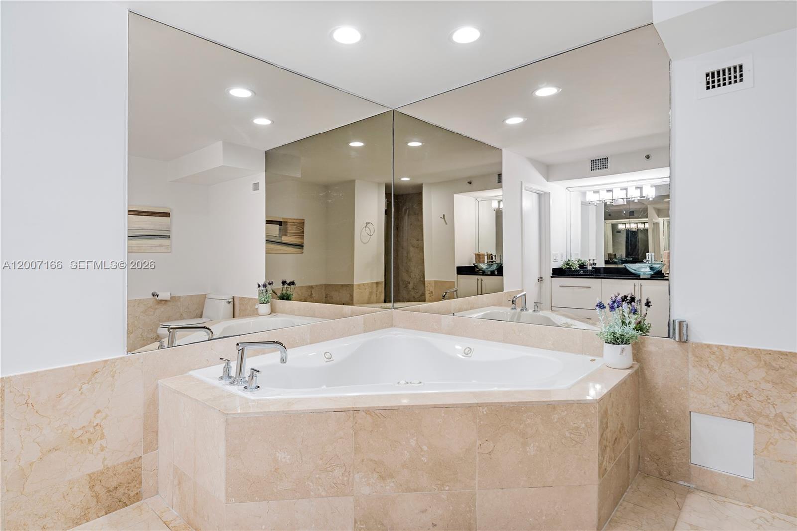 100 Lincoln Road, Unit 944 Miami Beach, FL 33139 - Photo 18 of 40 a large spacious bathroom with a large tub and sink