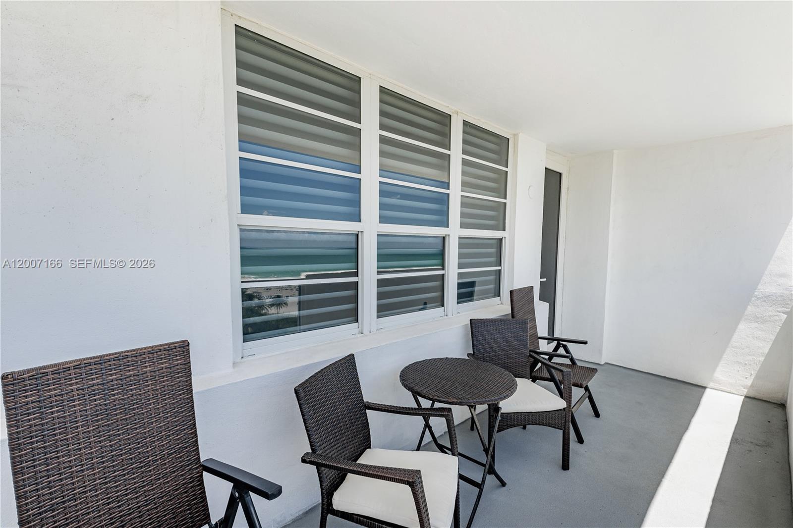100 Lincoln Road, Unit 944 Miami Beach, FL 33139 - Photo 22 of 40 a view of a workspace with furniture and a window