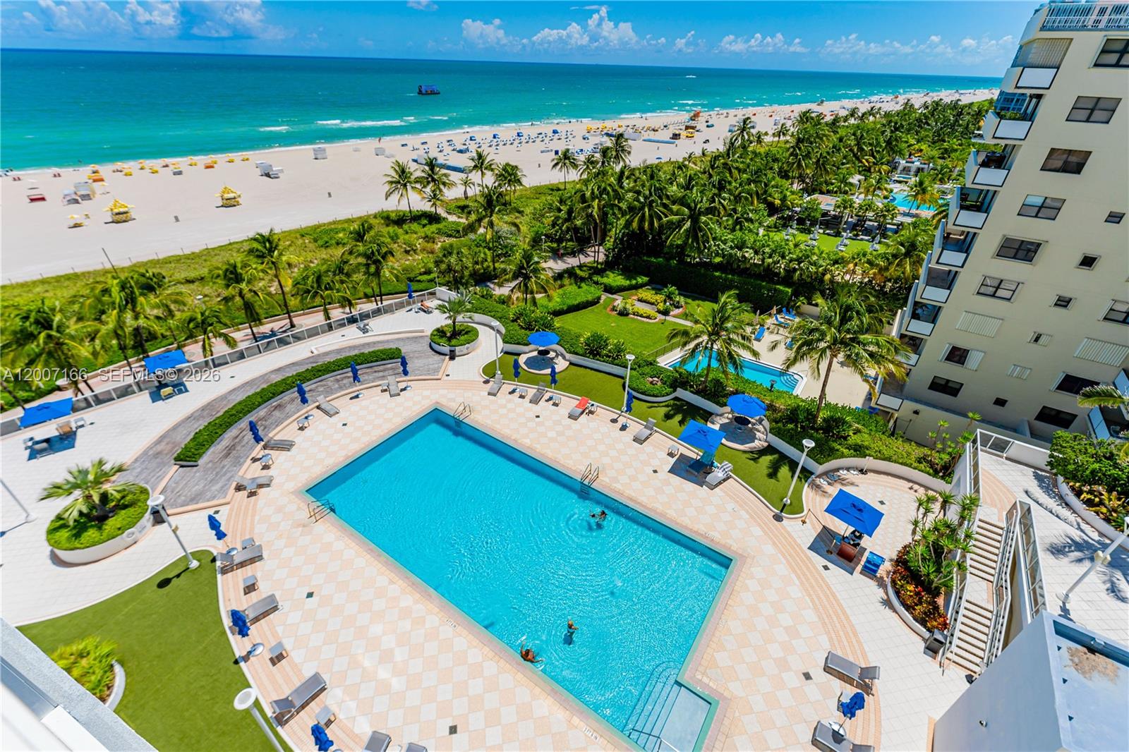 100 Lincoln Road, Unit 944 Miami Beach, FL 33139 - Photo 32 of 40 a view of a swimming pool with a yard
