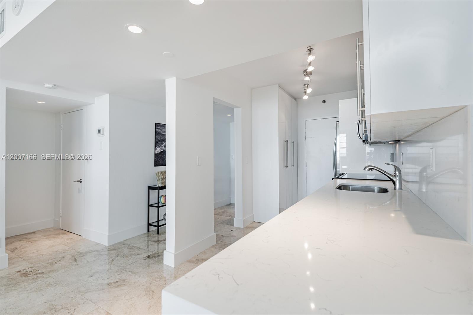 100 Lincoln Road, Unit 944 Miami Beach, FL 33139 - Photo 6 of 40 a view of a kitchen and chandelier