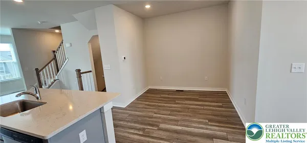 a view of a hallway with a kitchen