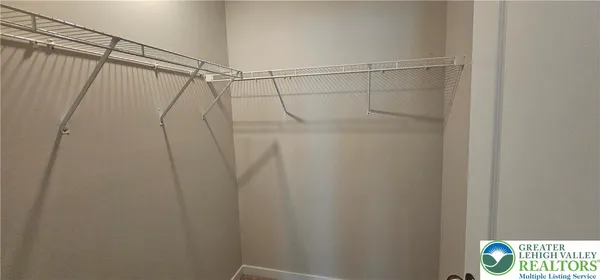 a bathroom with a shower and a curtain