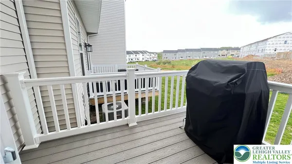 a view of a balcony with furniture