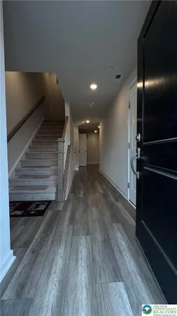 a view of gallery with wooden floor