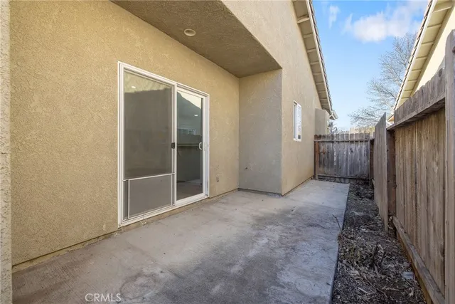 a view of balcony with wooden floor