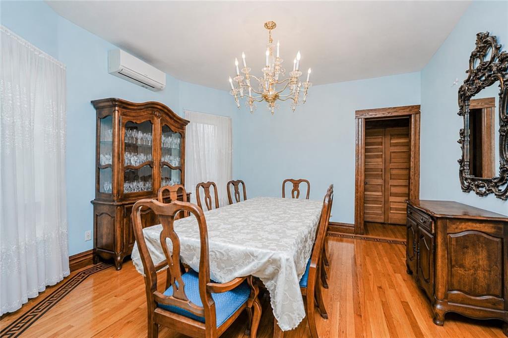 1352 Bay Ridge Parkway Brooklyn, NY 11228 - Photo 14 of 42 a view of a dining room with furniture and wooden floor