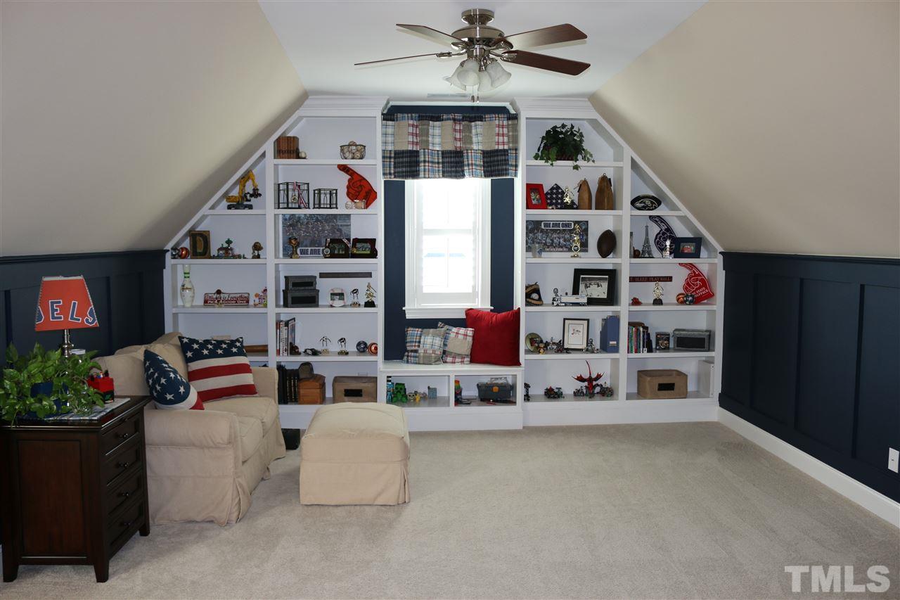 1108 Overlook Ridge Road Wake Forest, NC 27587 - Photo 11 of 14 a living room with lots of furniture and white cabinets