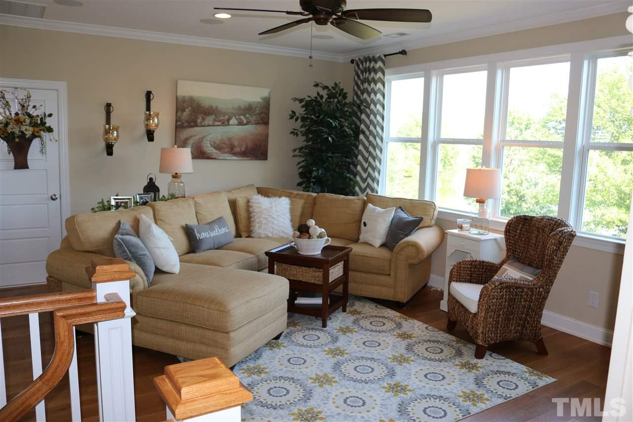 1108 Overlook Ridge Road Wake Forest, NC 27587 - Photo 13 of 14 a living room with furniture and a large window