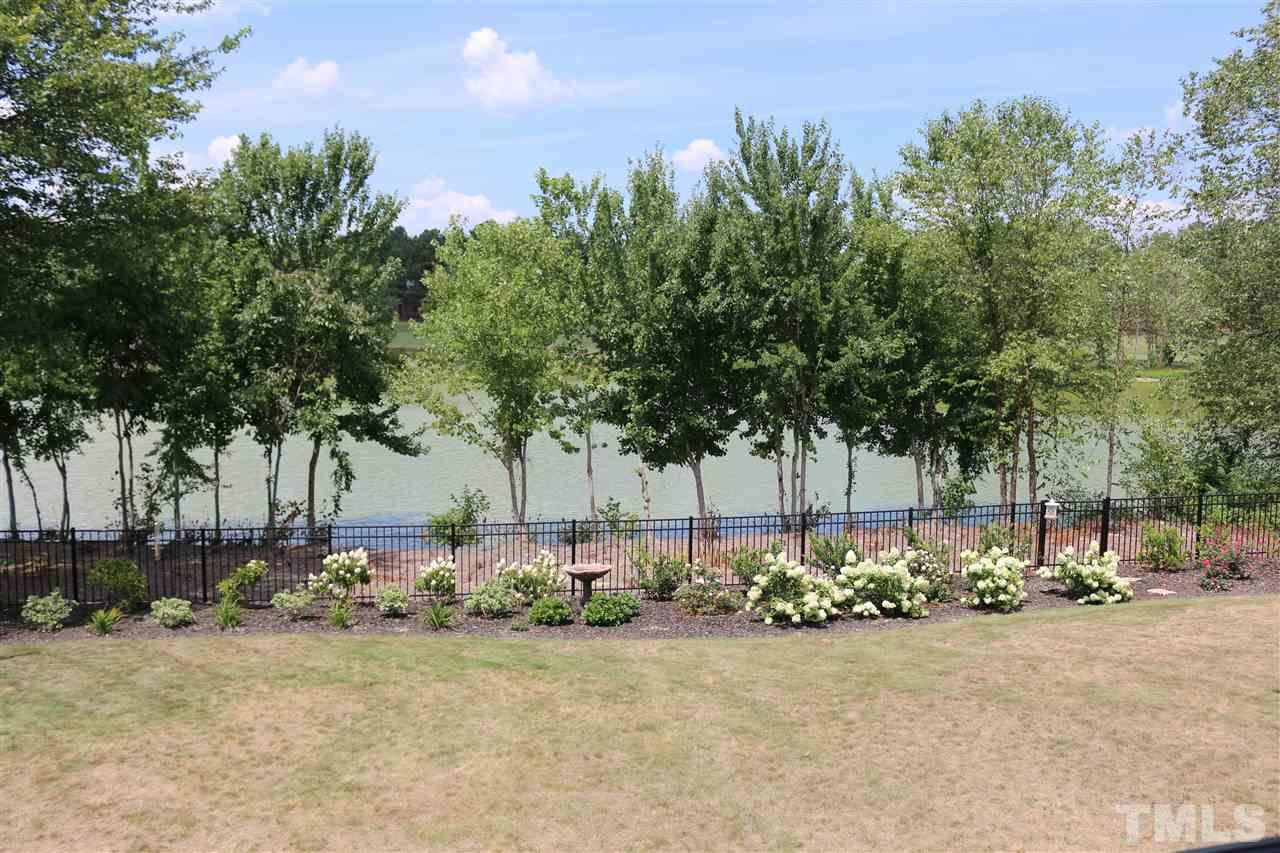 1108 Overlook Ridge Road Wake Forest, NC 27587 - Photo 14 of 14 a view of a yard with a tree